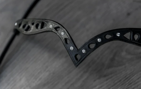 Bridle with a carved detail and white stones
